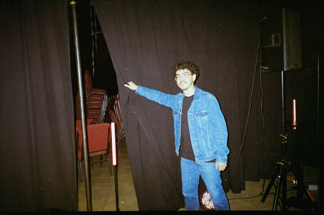 retro tv show host on stage