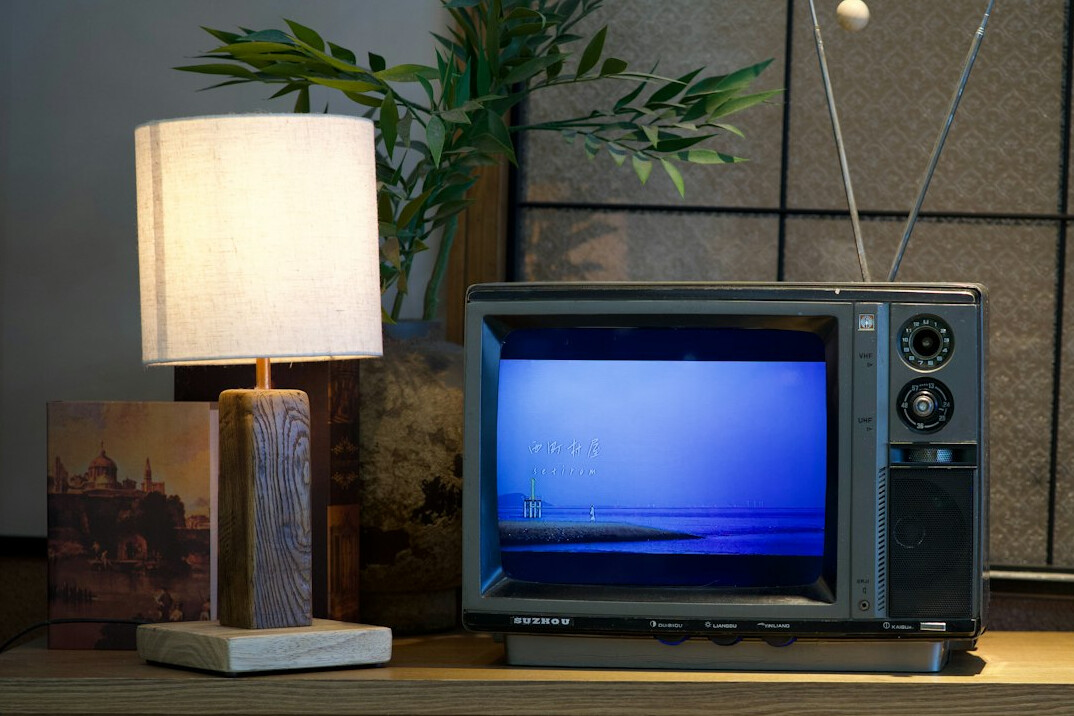 vintage television set on wooden table