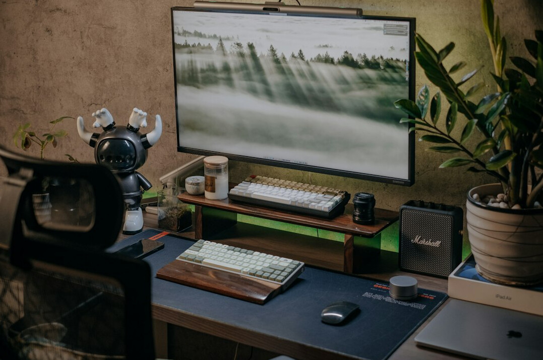 Video editing desk with multiple monitors and a timeline
