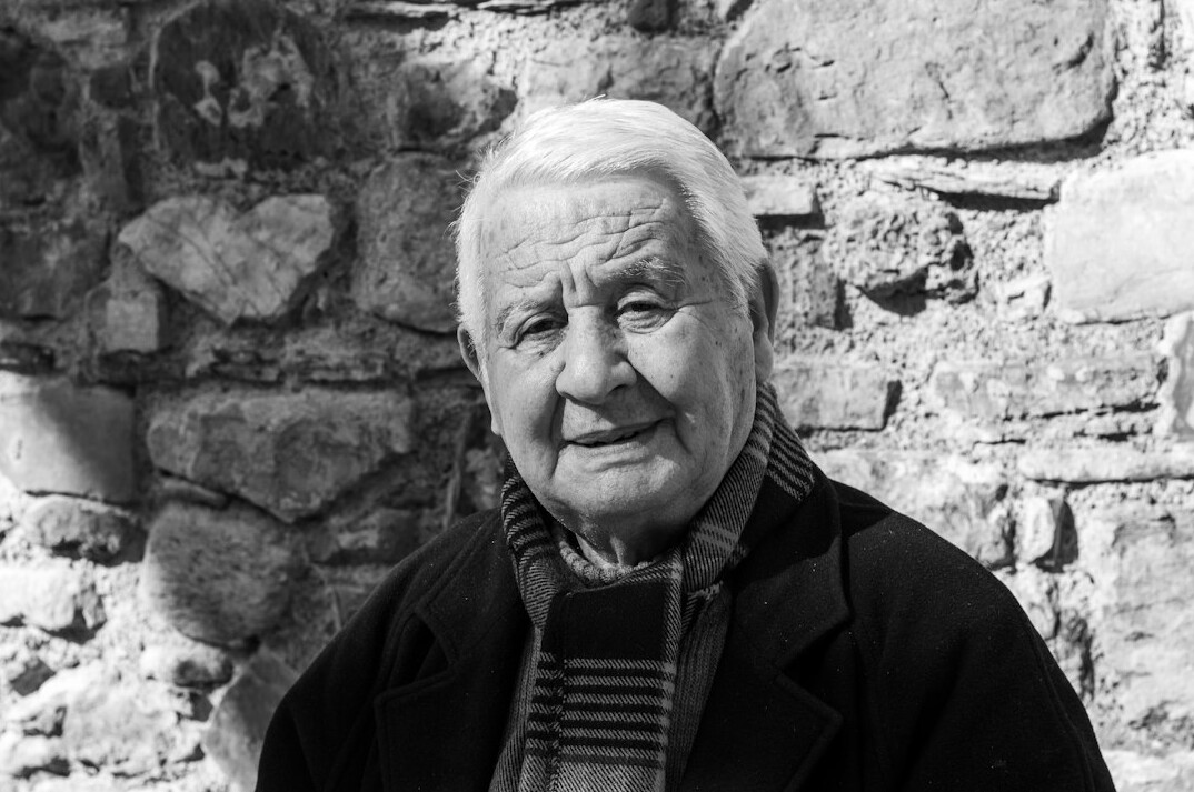 old french tv host smiling